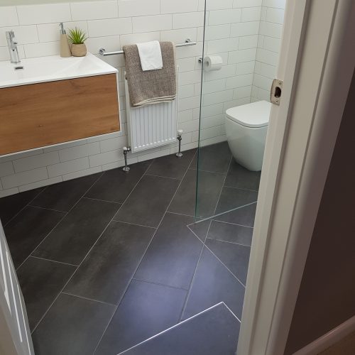 Grey floor tiles in ensuite