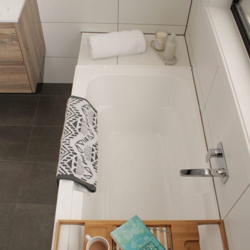 Bath with methven spout and mixer and bamboo bath caddy