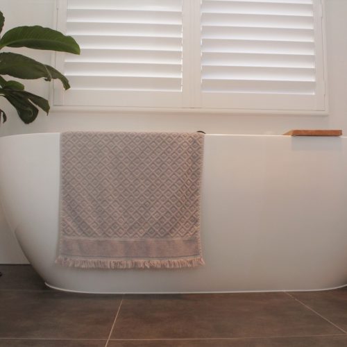 white bath with caddy