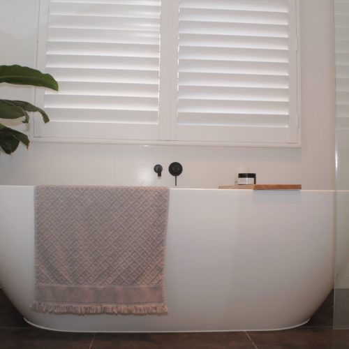 freestanding bath with Matte black tap spout